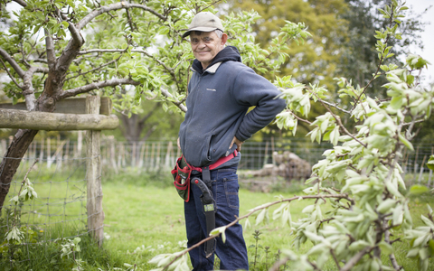 Martin stands in a garden
