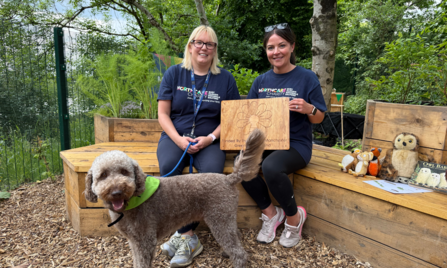 Catherine, Emma and Herbie the dog with their Green Spaces Fund plaque