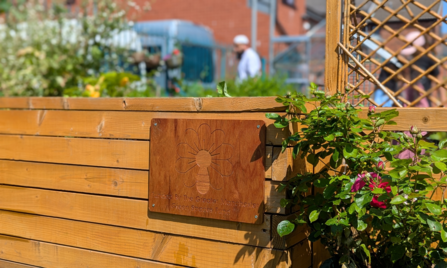 The group's Green Spaces Fund plaque taking pride of place in the garden