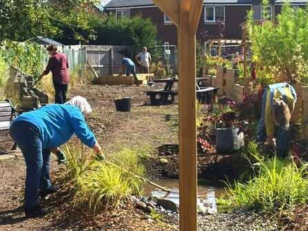 The Monastery Gorton - People working in garden