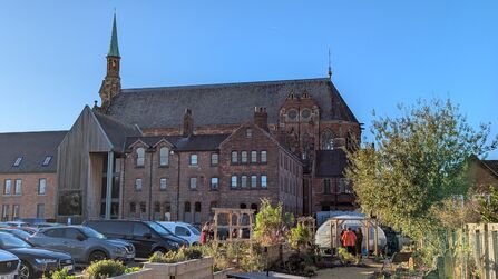 Gorton Monastery on a sunny winter day, showing the community garden outside